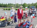 Dragsters greet Cele before the Fourth of July Parade